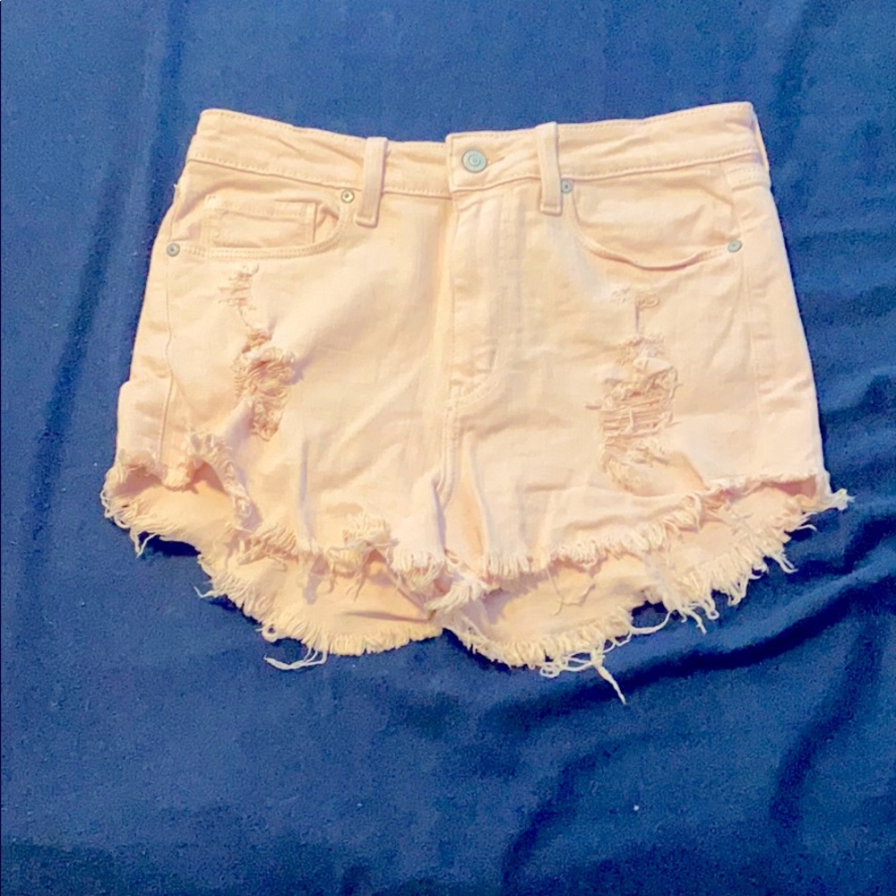 Light pink distressed jean shorts